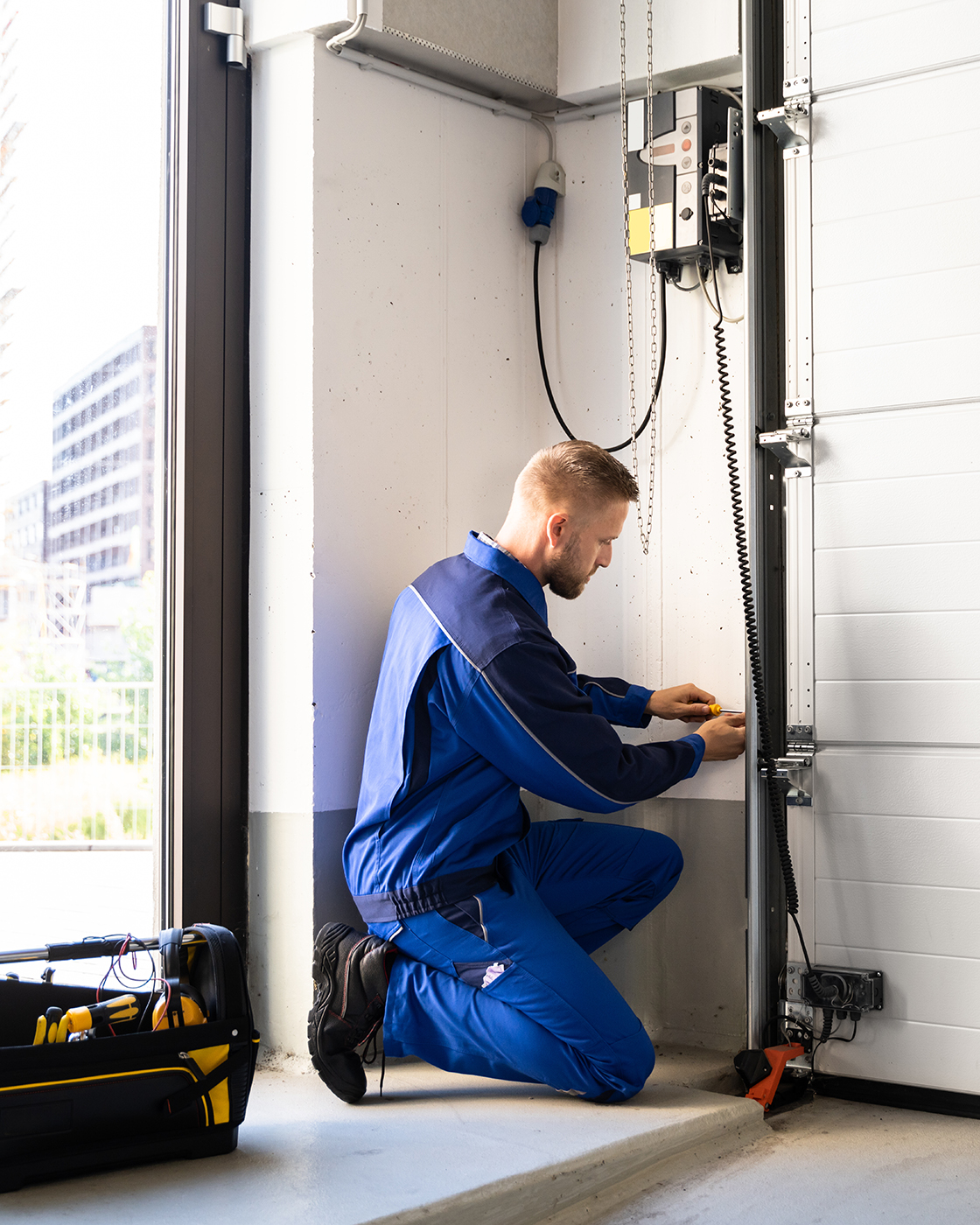 Garage Door Installation And Repair At Home. Contractor Man