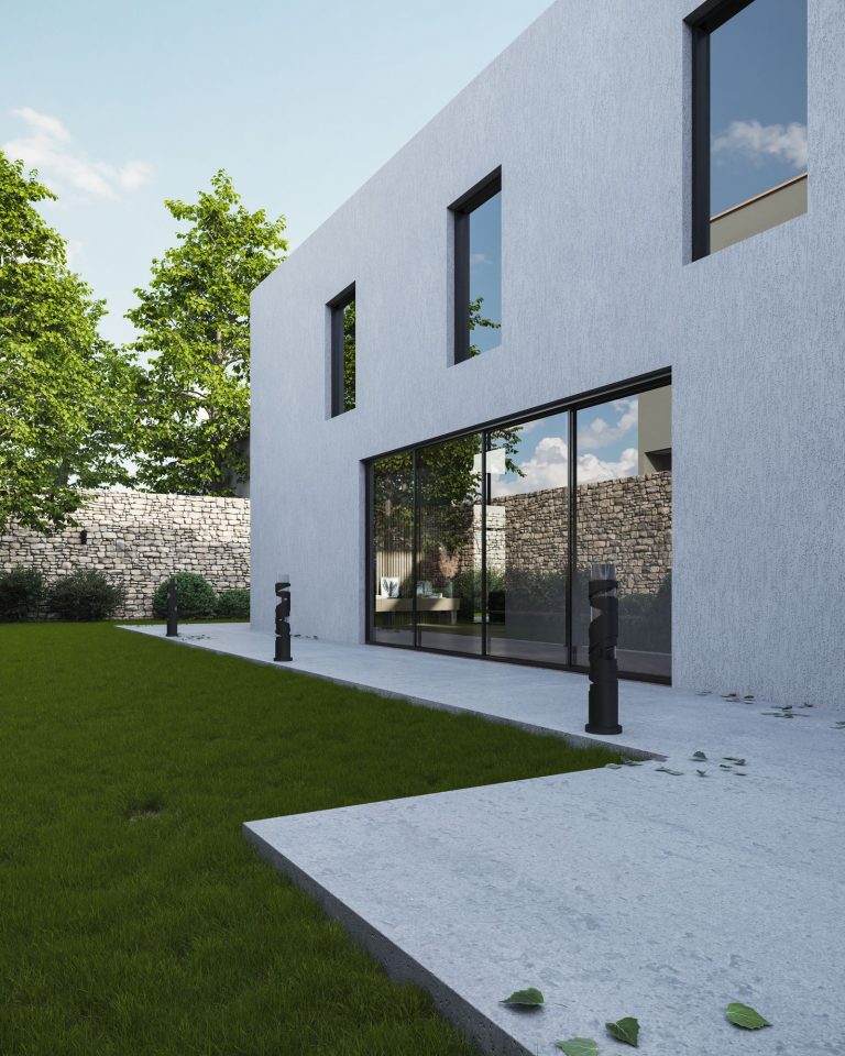 Maison individuelle à la façade enduite blanche après isolation par l’extérieur